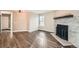 Living room with hardwood floors and a stone fireplace at 909 S Dawson Way # 7, Aurora, CO 80012