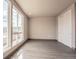 Well-lit bedroom featuring large windows and wood-look floors at 12983 W Ida Ave # 217, Littleton, CO 80127