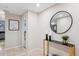 Bright and airy entryway with a stylish console table and large mirror at 1777 Larimer St # 808, Denver, CO 80202