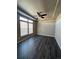 Bright bedroom with dark vinyl flooring and ceiling fan at 5046 Espana Way, Denver, CO 80249