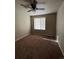 Bright bedroom with ceiling fan and window, offering peaceful views at 5046 Espana Way, Denver, CO 80249