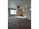 Bright bedroom with ceiling fan and large window, offering ample space at 5046 Espana Way, Denver, CO 80249