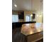 Kitchen with dark cabinets, granite countertops and island at 5046 Espana Way, Denver, CO 80249