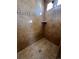 Large walk-in shower with neutral tile and built-in shelving at 5046 Espana Way, Denver, CO 80249