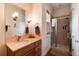 Bathroom with granite vanity, shower, and ample storage at 3883 E Fox Trl, Littleton, CO 80121