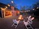 Relaxing firepit area with barn backdrop and string lights at 3883 E Fox Trl, Littleton, CO 80121