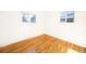 Bright bedroom with hardwood floors and two large windows at 11531 E Dakota Ave, Aurora, CO 80012