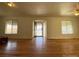 Living room with hardwood floors and access to front door at 1453 Chester St, Aurora, CO 80010
