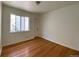 Bright bedroom with hardwood floors and a closet at 1453 Chester St, Aurora, CO 80010