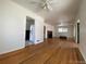 Hardwood floors and views into kitchen and other rooms from this living room at 1453 Chester St, Aurora, CO 80010