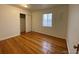 Bright bedroom featuring hardwood floors and a closet at 1453 Chester St, Aurora, CO 80010