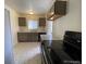 Updated kitchen with dark cabinets, new flooring and appliances at 1453 Chester St, Aurora, CO 80010