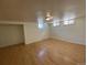 Finished basement features hardwood floors, lots of light, and a closet at 1453 Chester St, Aurora, CO 80010