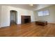 Living room with hardwood floors, fireplace, and large windows at 1453 Chester St, Aurora, CO 80010