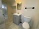 Basement bathroom with gray vanity and marble floors at 1453 Chester St, Aurora, CO 80010
