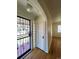 Bright entryway with hardwood floors, glass block windows, and a security door at 1453 Chester St, Aurora, CO 80010