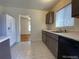 Kitchen with updated cabinets and flooring, plus appliances at 1453 Chester St, Aurora, CO 80010