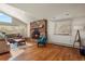 Living room with a stone fireplace and hardwood floors at 28730 Mountain View Rd, Conifer, CO 80433