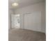 Well-lit bedroom with carpet floors and double door closet at 28730 Mountain View Rd, Conifer, CO 80433