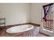 Bathroom with large bathtub and access to a private deck at 28730 Mountain View Rd, Conifer, CO 80433