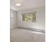 Serene bedroom with a large window and carpet flooring at 28730 Mountain View Rd, Conifer, CO 80433