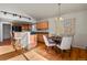 Bright kitchen with wood cabinets, black appliances, and an island at 28730 Mountain View Rd, Conifer, CO 80433
