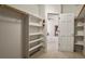 Walk-in closet with built-in shelves and hanging rod at 28730 Mountain View Rd, Conifer, CO 80433