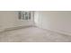Bright bedroom featuring carpet, a window, and a closet at 28730 Mountain View Rd, Conifer, CO 80433