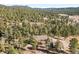Home nestled in a wooded mountainside setting at 28730 Mountain View Rd, Conifer, CO 80433