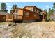 Two-story wooden house with large deck and mountain views at 28730 Mountain View Rd, Conifer, CO 80433
