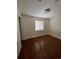 Small bedroom with laminate flooring and window at 4361 Argonne St, Denver, CO 80249