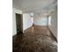 Living room with laminate flooring and access to kitchen and stairs at 4361 Argonne St, Denver, CO 80249