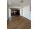Open concept living room and kitchen with laminate flooring at 4361 Argonne St, Denver, CO 80249