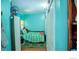 Small bedroom with a bed and teal walls at 11761 E Canal Dr, Aurora, CO 80011