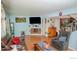 Bright living room, featuring hardwood floors and a corner fireplace at 11761 E Canal Dr, Aurora, CO 80011