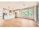 Bright dining room with hardwood floors and an open concept to the kitchen at 5620 Cottontail Dr, Longmont, CO 80503