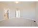 Bright bedroom with carpeted floors and en-suite bathroom access at 5620 Cottontail Dr, Longmont, CO 80503