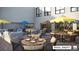 Outdoor patio area with comfortable seating and umbrellas at 12983 W Ida Ave # 200, Littleton, CO 80127