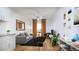 Cozy living room with hardwood floors and ample natural light at 12983 W Ida Ave # 200, Littleton, CO 80127