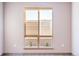 Bedroom with a large window offering natural light at 12983 W Ida Ave # 200, Littleton, CO 80127