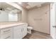 Clean bathroom with white vanity and neutral tile at 12983 W Ida Ave # 200, Littleton, CO 80127