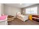 Charming bedroom with a twin-size bed, and toy storage at 27089 E Cedar Ave, Aurora, CO 80018