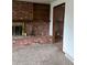 Living room with brick fireplace and access to another room at 8536 Eaton St, Arvada, CO 80003