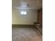 Spacious basement with carpeted floor and brick wall at 8536 Eaton St, Arvada, CO 80003