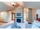 Bedroom with fireplace and ensuite bathroom at 5764 Amber Ridge Dr, Castle Pines, CO 80108