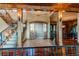 Elegant entryway with a wooden staircase and view into the dining room at 5764 Amber Ridge Dr, Castle Pines, CO 80108
