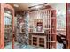 Extensive wine cellar with stone and wood shelving at 5764 Amber Ridge Dr, Castle Pines, CO 80108
