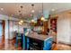 Gourmet kitchen featuring granite island and custom cabinetry at 5764 Amber Ridge Dr, Castle Pines, CO 80108