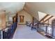 Spacious upper landing with two chairs and wrought-iron railings at 5764 Amber Ridge Dr, Castle Pines, CO 80108
