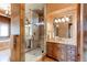Elegant bathroom with double vanity and large walk-in shower at 5764 Amber Ridge Dr, Castle Pines, CO 80108